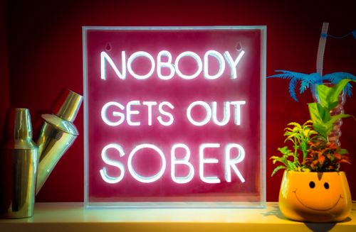 NOBODY GETS OUT SOBER (white)