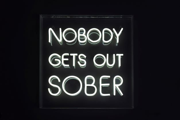NOBODY GETS OUT SOBER (white)