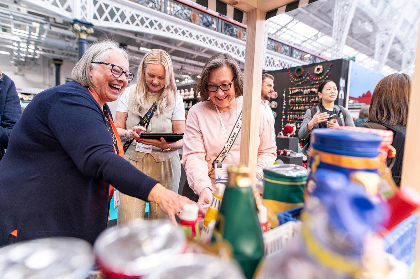 Buyers happily chatting to an exhibitor at Top Drawer