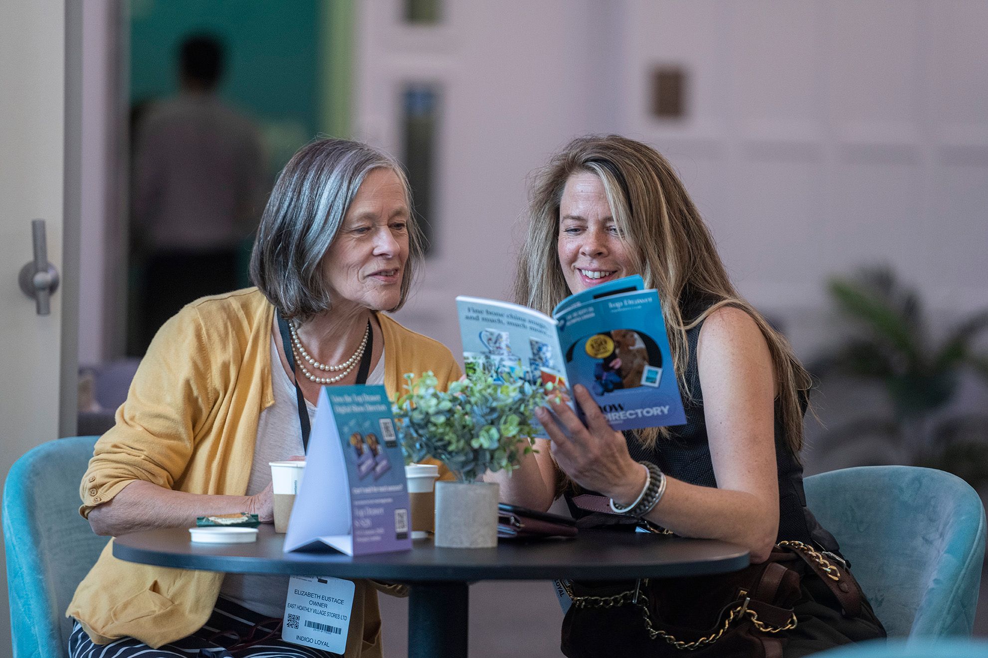 two buyers in the Top Drawer Indigo Lounge Planning their Visit