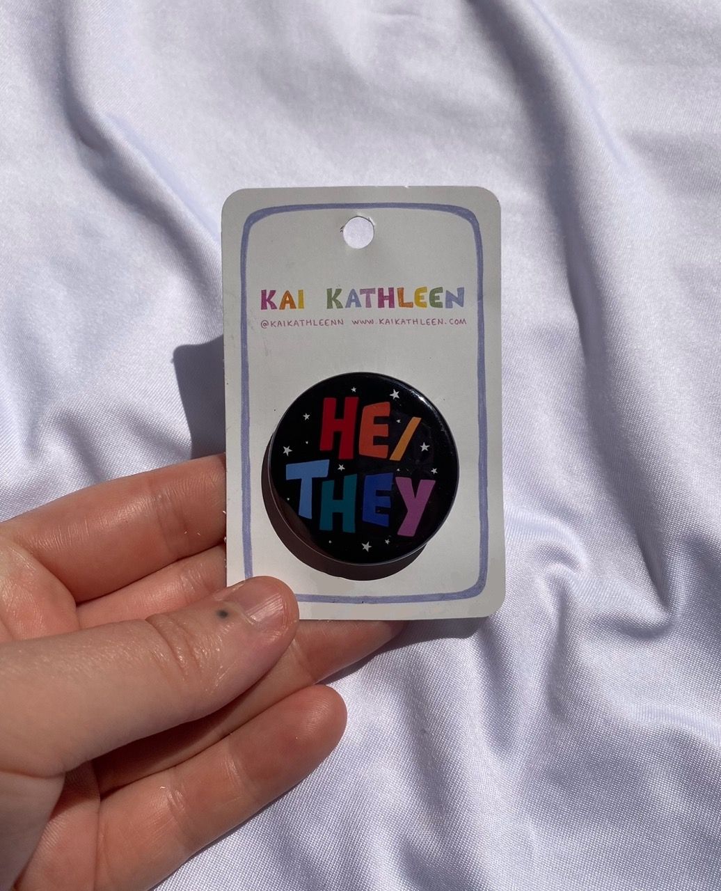 He/they pronoun badge