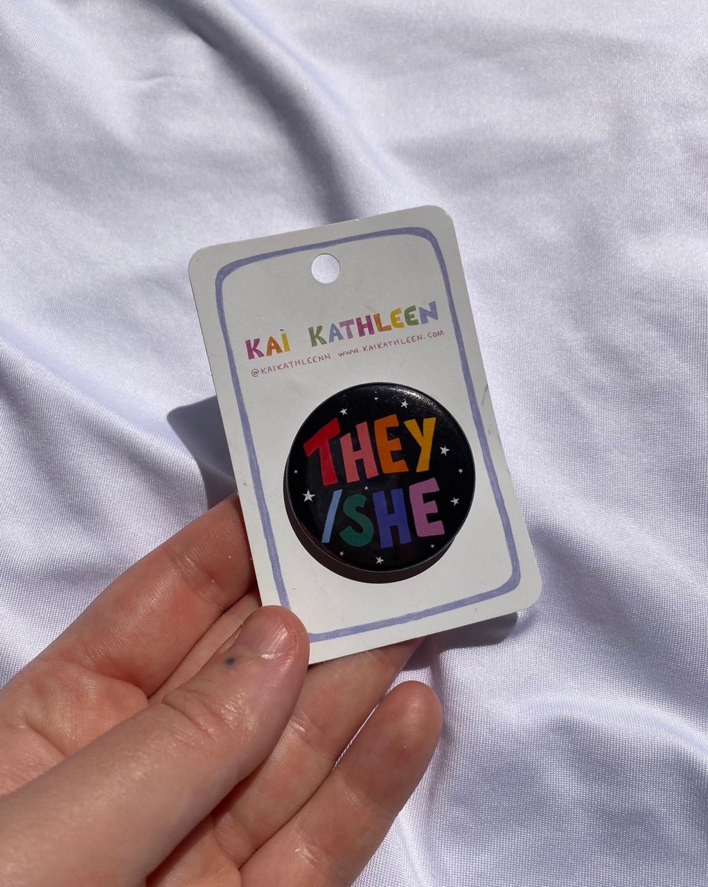 They/she pronoun badge