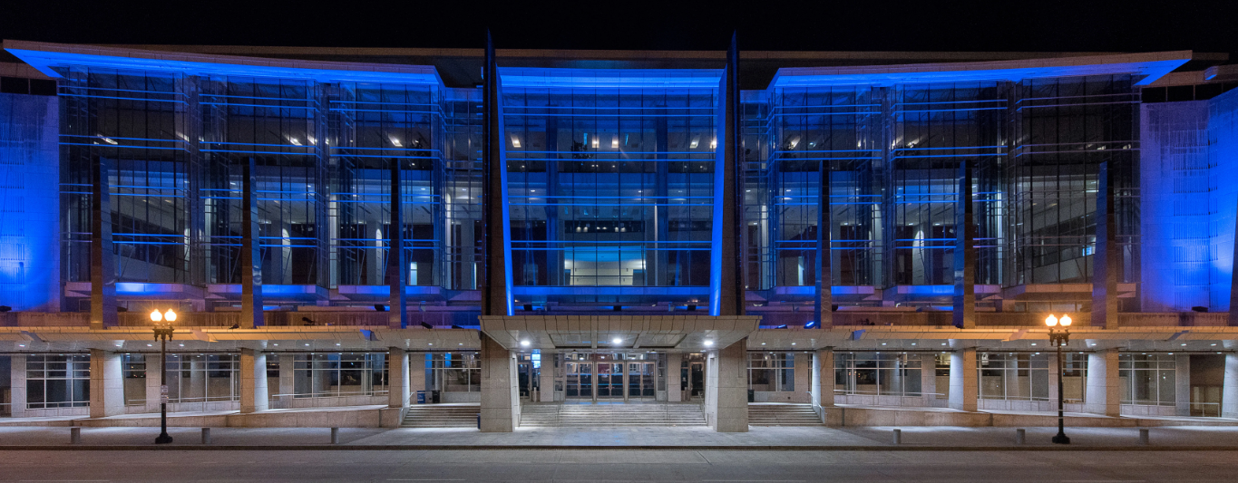 Exterior shot of the Walter E. Washington Convention Center lit blue