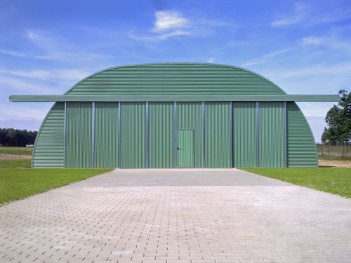 Relocatable metal aircraft shelter