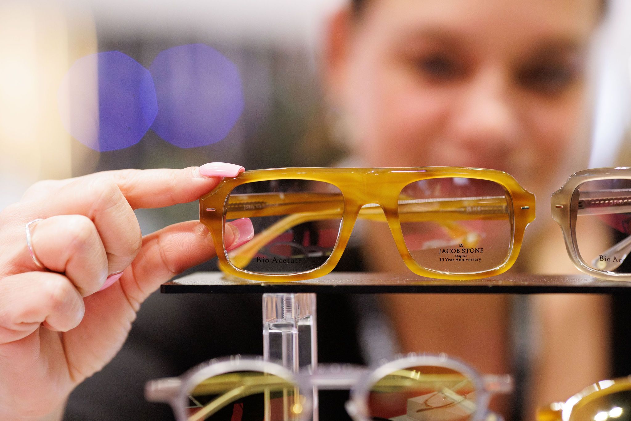 A pair of frames on display at 100% Optical.