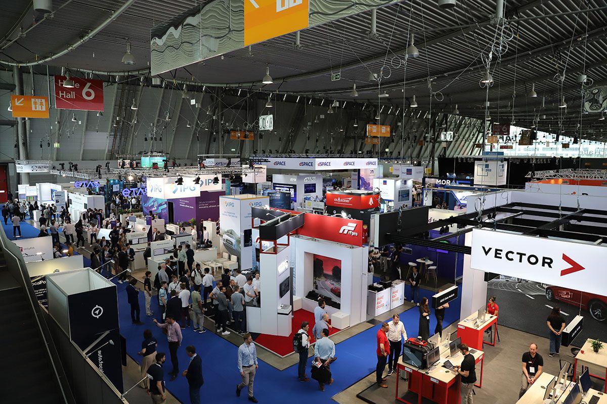 Photo shows an over-head view of the expo with booths filling the event space