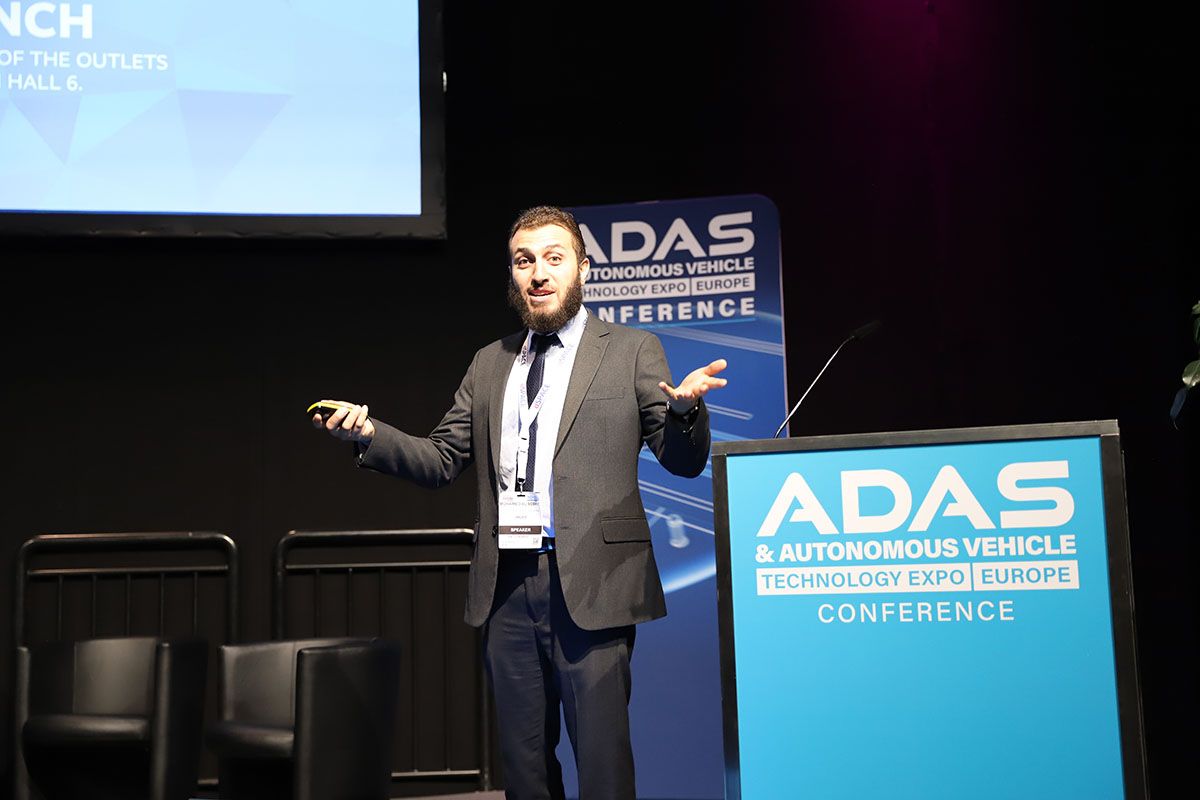 Photo shows a speaker at the ADAS conference