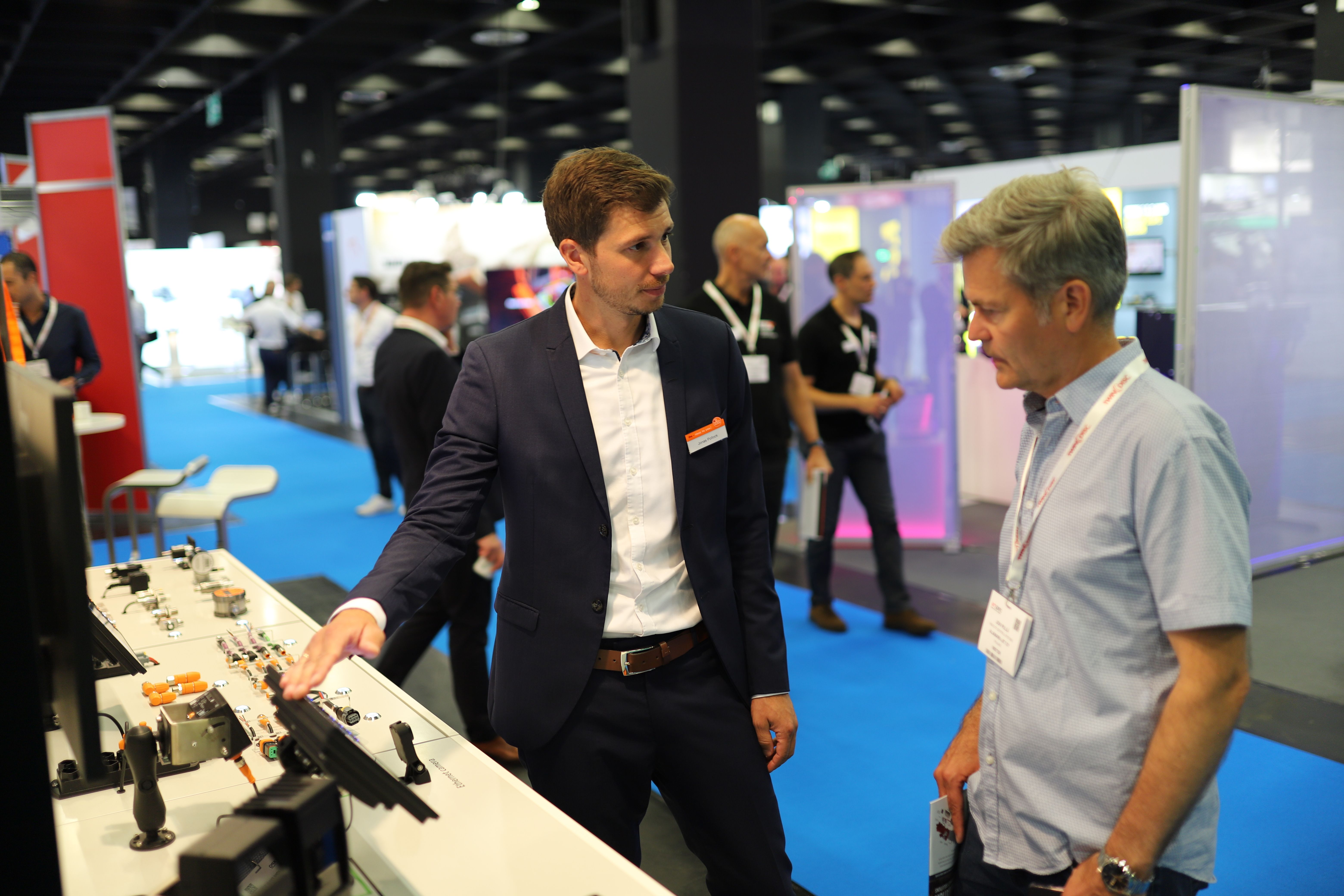 Photo showing two men having a conversation on the show floor at iVT Expo Cologne in 2024