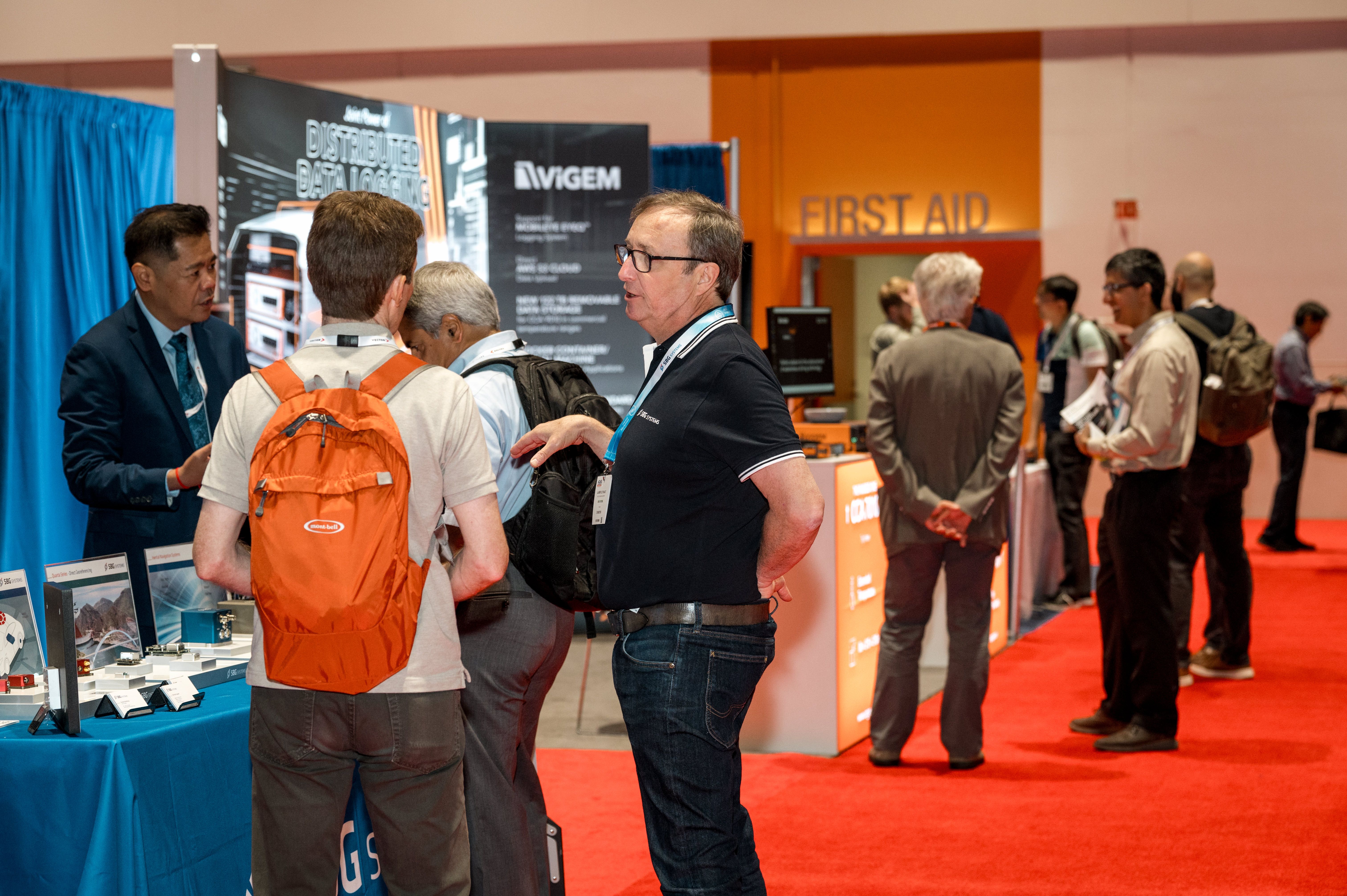 Exhibitor and visitor discussing on both at ADAS California