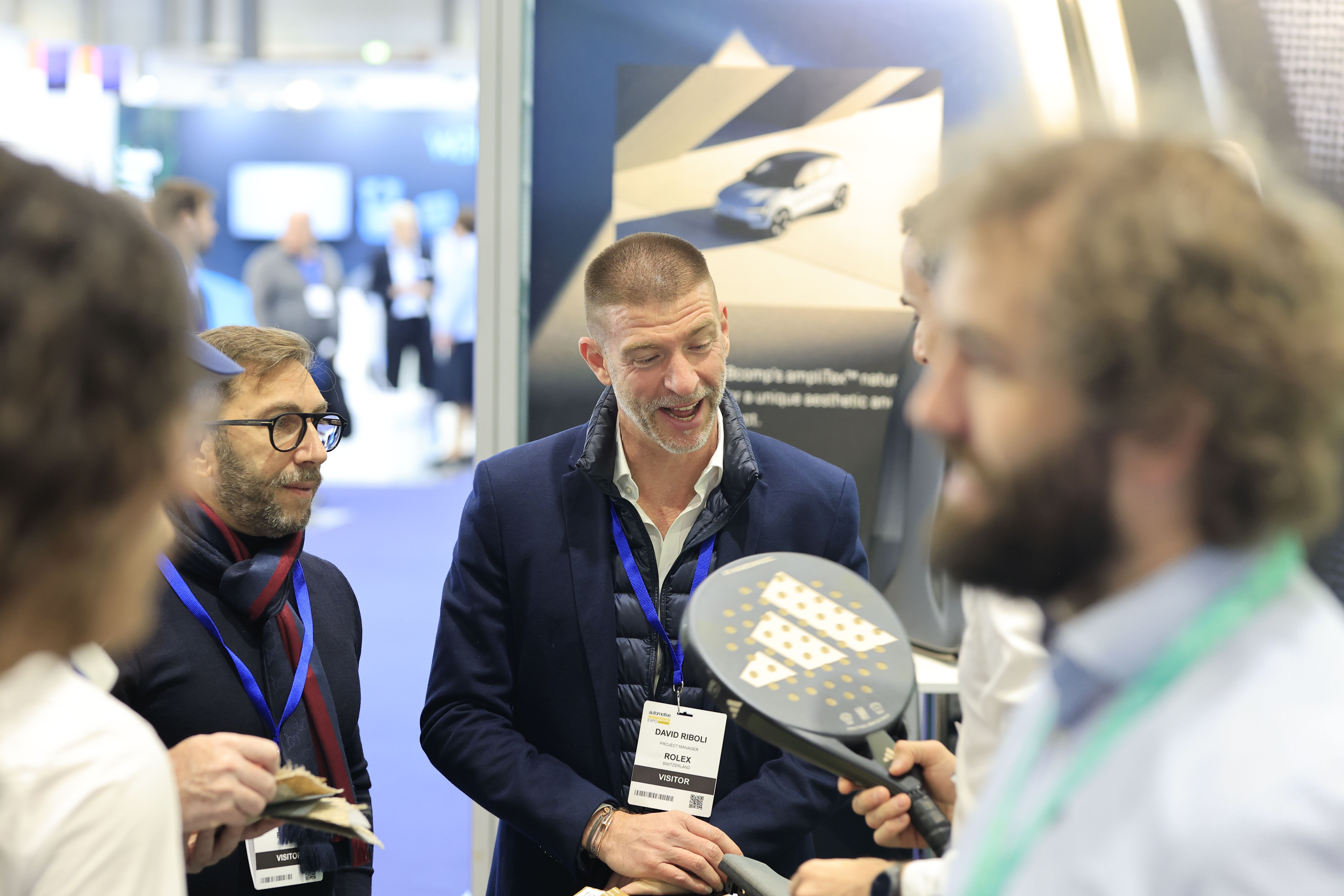 Images shows visitors and exhibitors networking at Automotive Interiors Expo North America