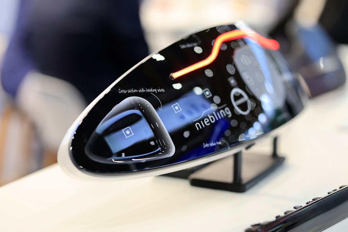 Photo shows a close up of tech on display at the Automotive Interiors expo