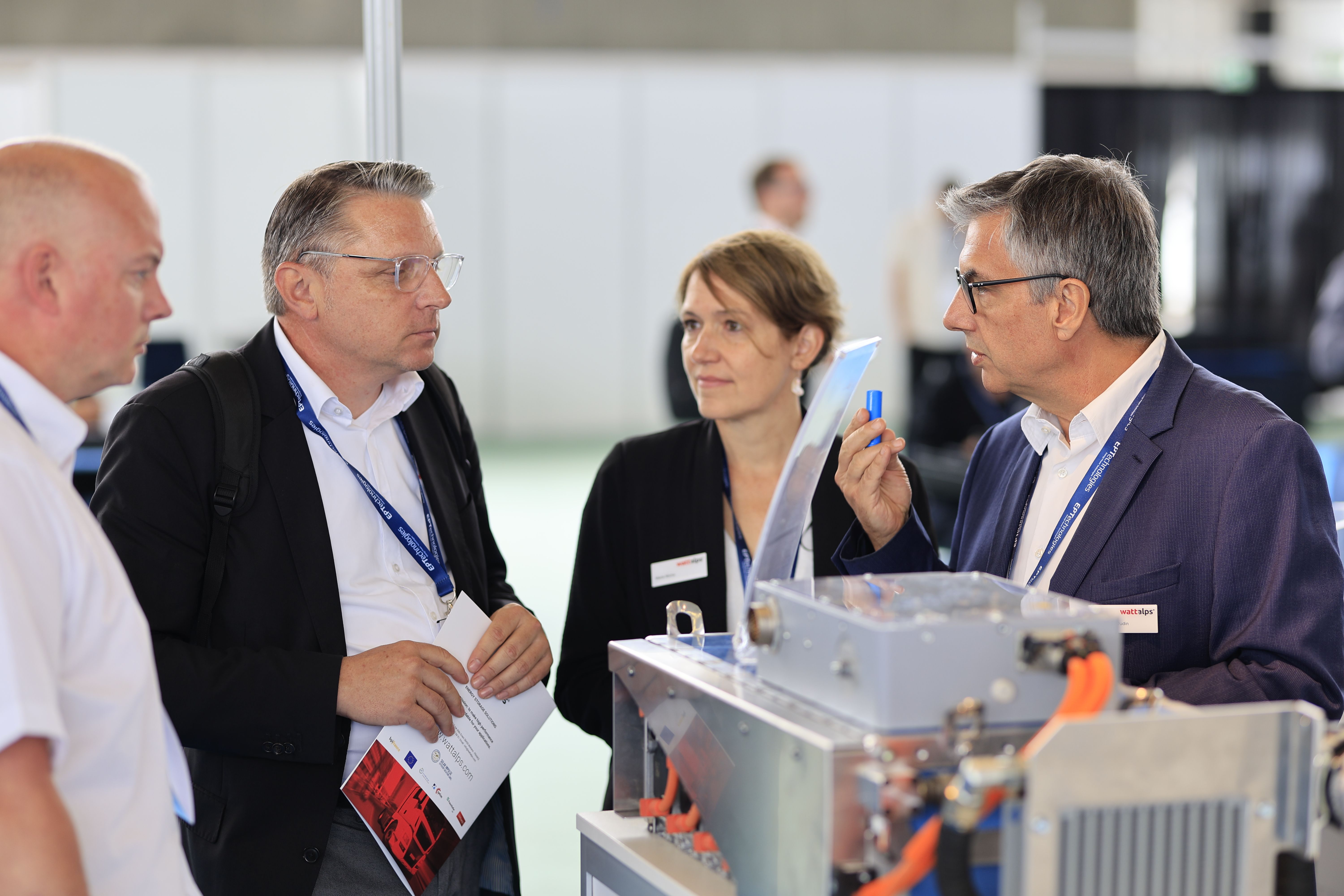 Photo shows exhibitor and visitors on stand at Advanced Maritime Technology Expo