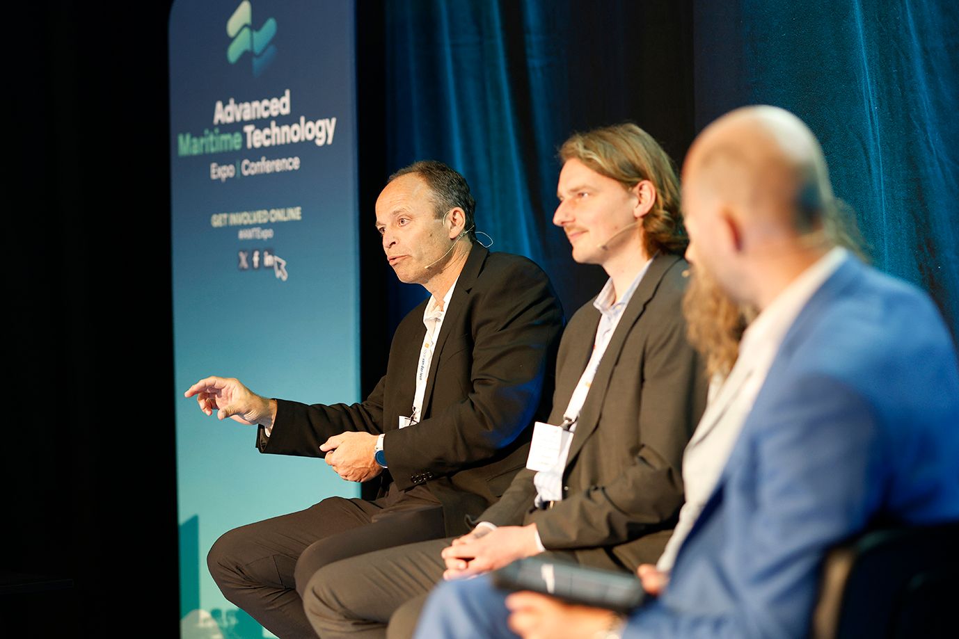 Photo shows a panel of experts at Advanced Maritime Technology conference