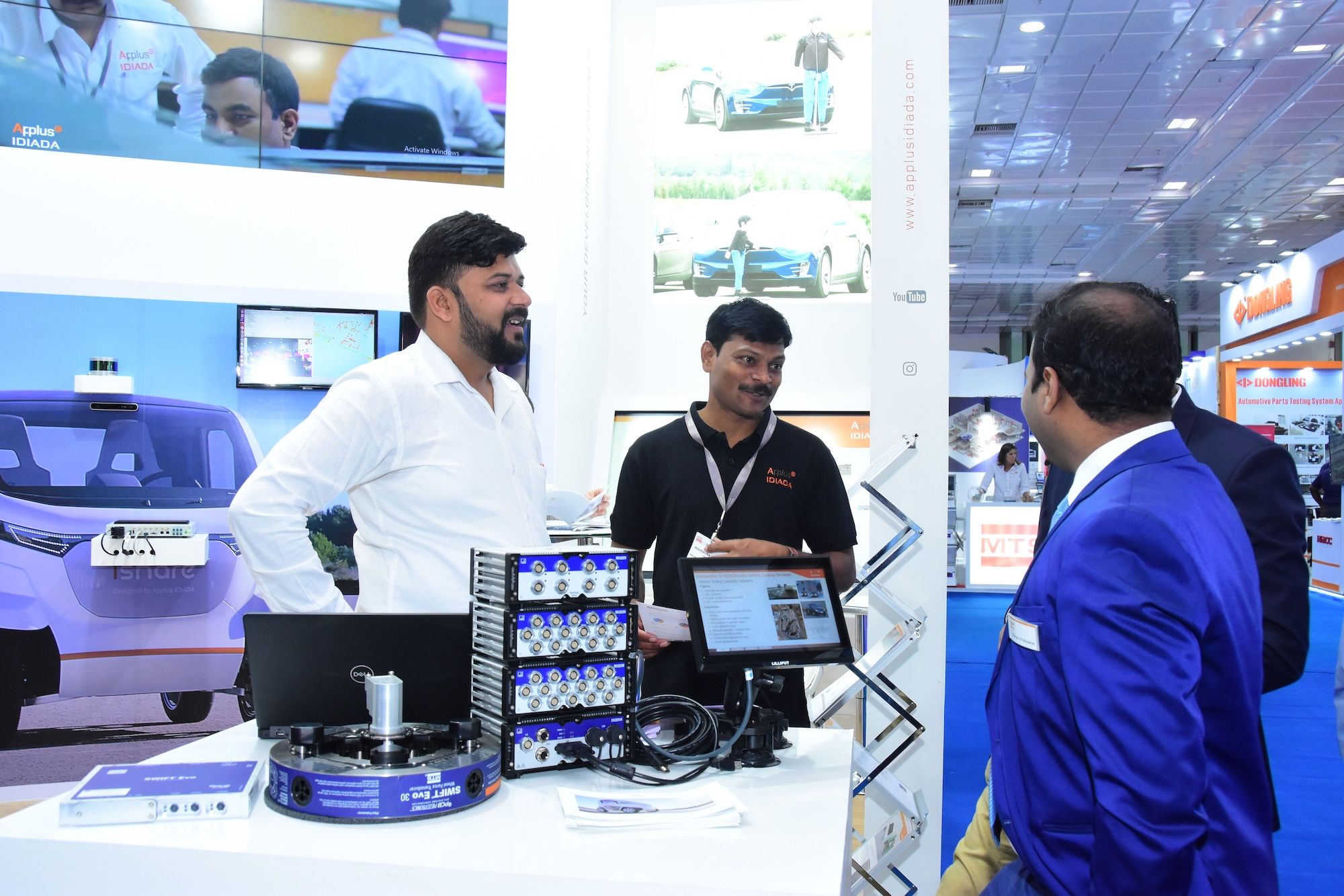 Photo shows an exhibitor at Automotive Testing Expo India networking with visitors at their booth 