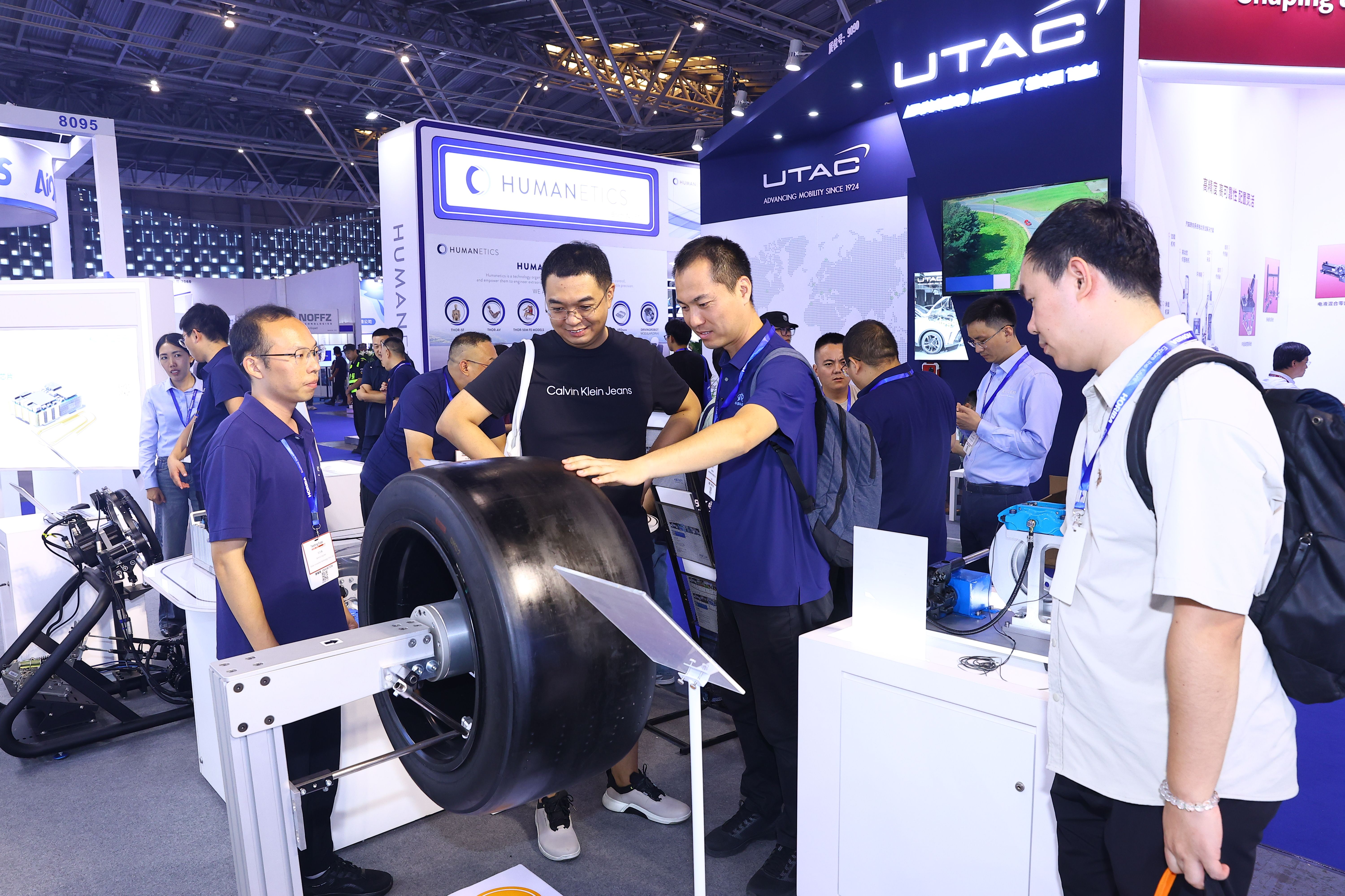 Image shows a busy booth at Testing Expo China Automotive