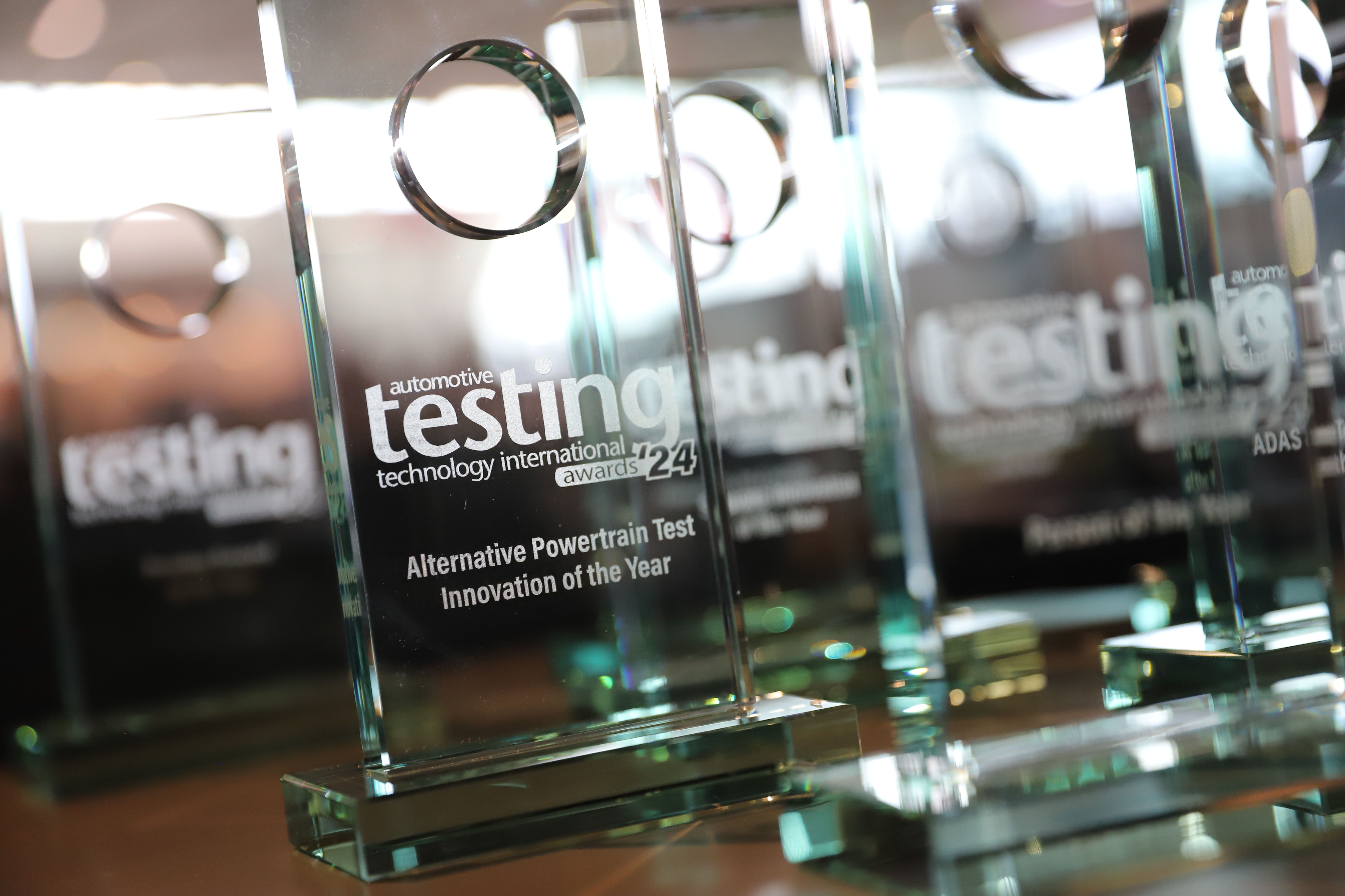 Image shows multiple trophies for the Automotive Technology International Awards