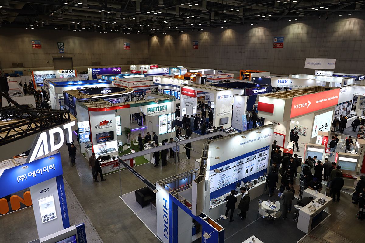 Photo shows an over-head view of the expo with booths filling the event space