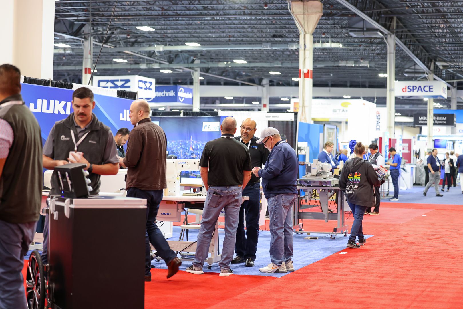 Photo shows a busy show floor at Automotive Testing Expo North America