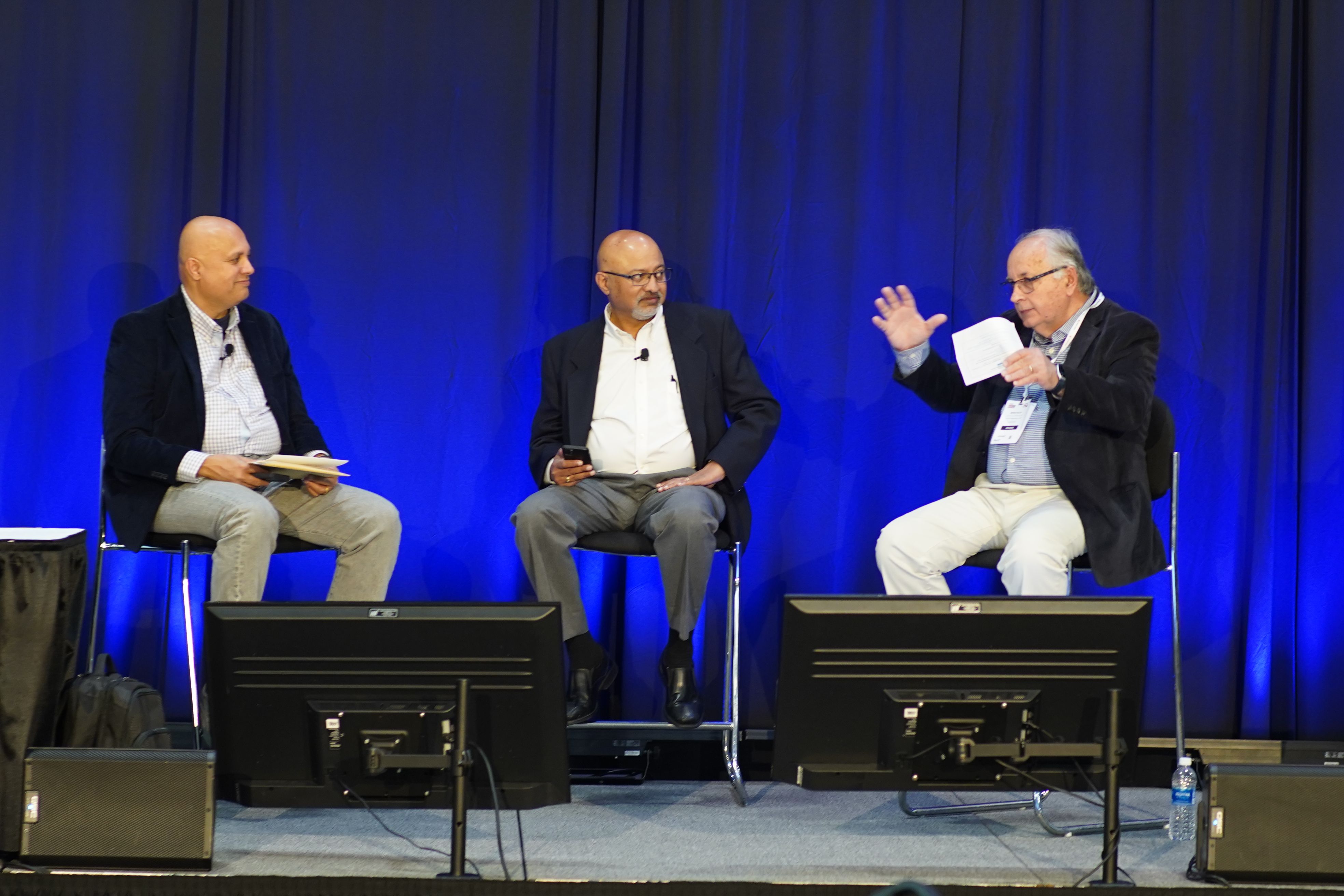 Photo shows a panel at the Future Of Automotive Testing conference