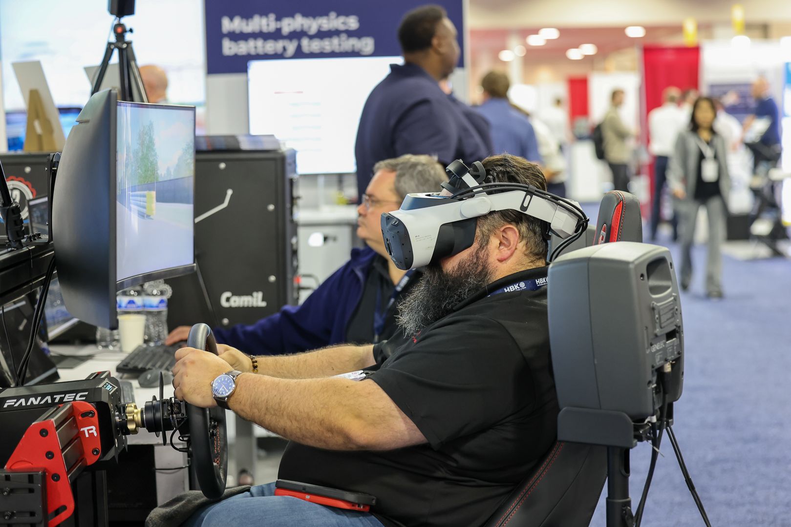 Photo shows a Automotive Testing Expo visitor trying VR technology