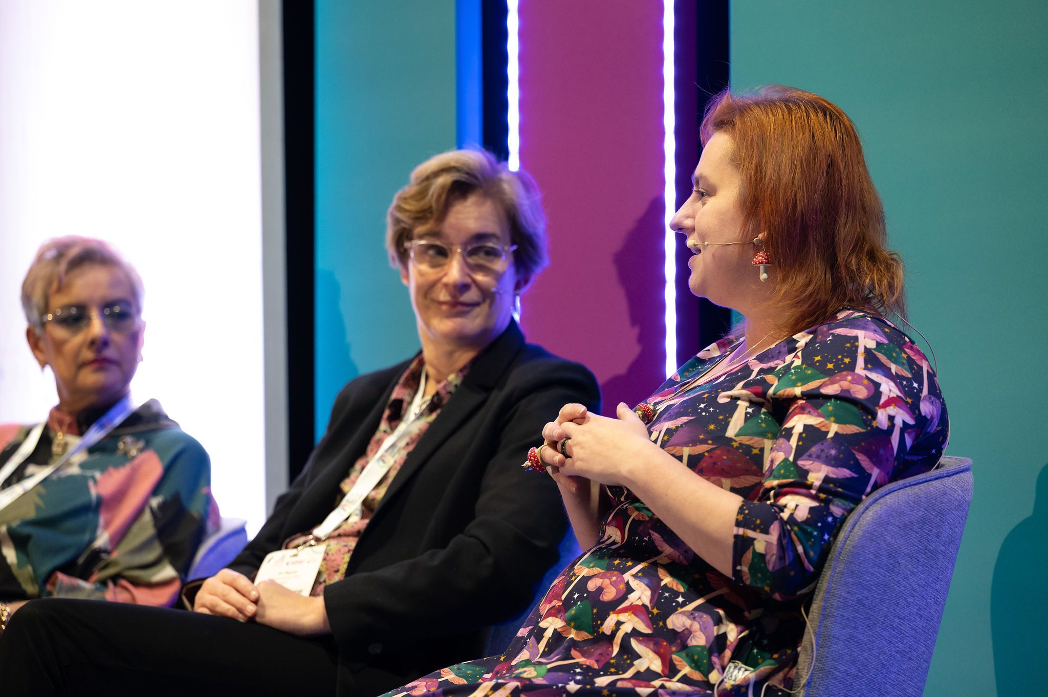 Three women speaking in the keynote theatre