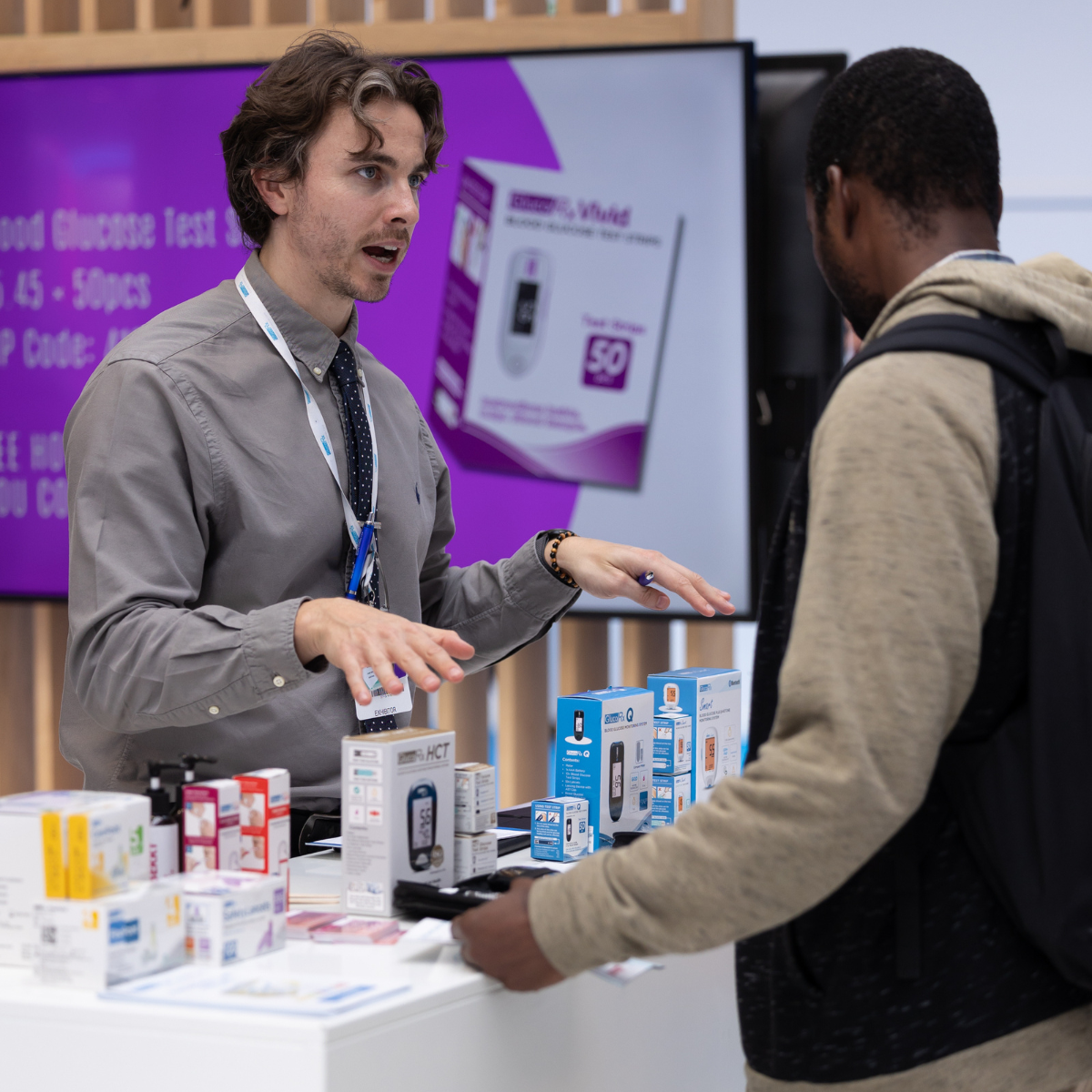 An exhibitor on the Gluco RX at CVRM Professional care taking to potential customers