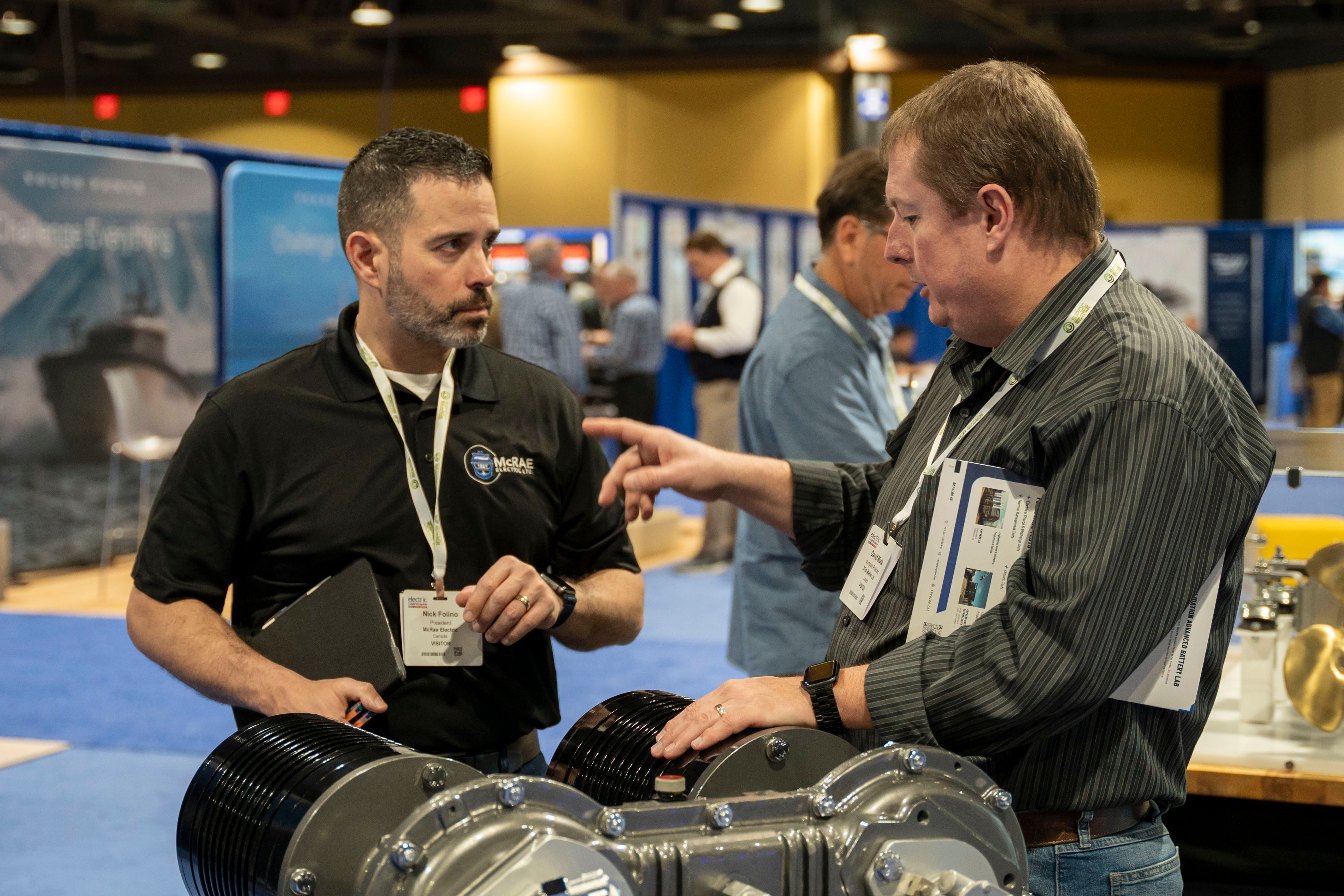 Photo shows Electric & Hybrid Marine Expo attendees networking