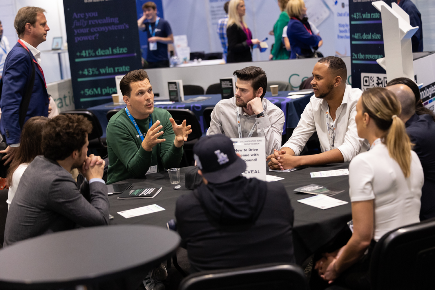 Professionals gathered round a table in the Collaboration Zone