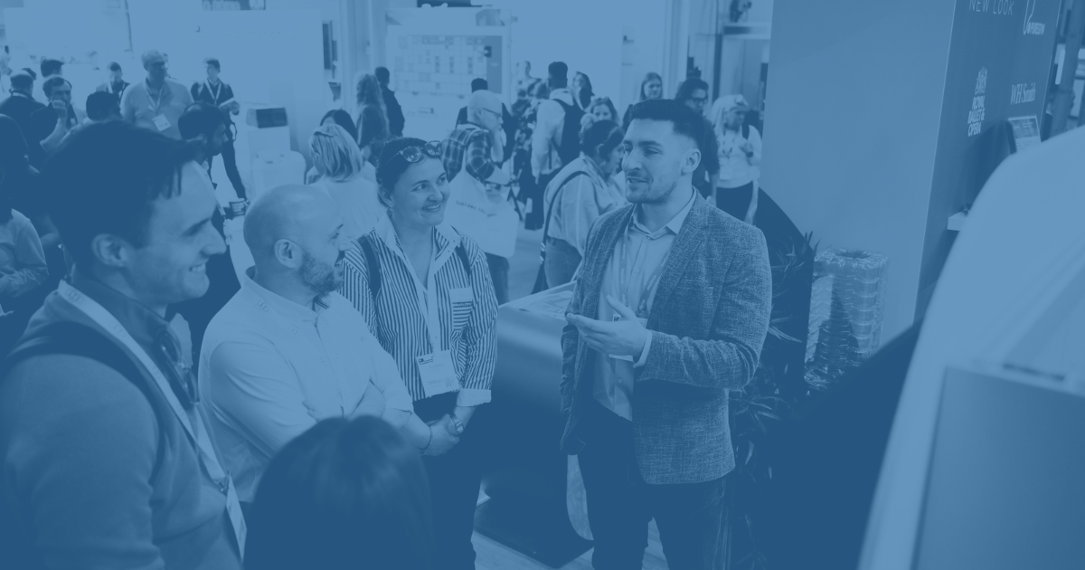 Discussion taking place at an exhibitors stand at HR Technologies UK 2026