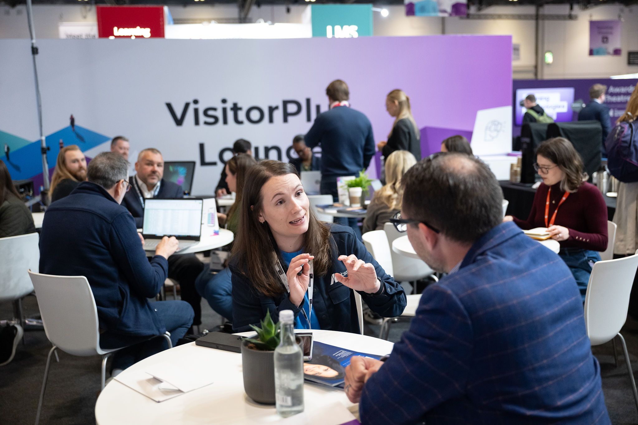 An interaction between a visitor and an exhibitor at HR Technologies UK