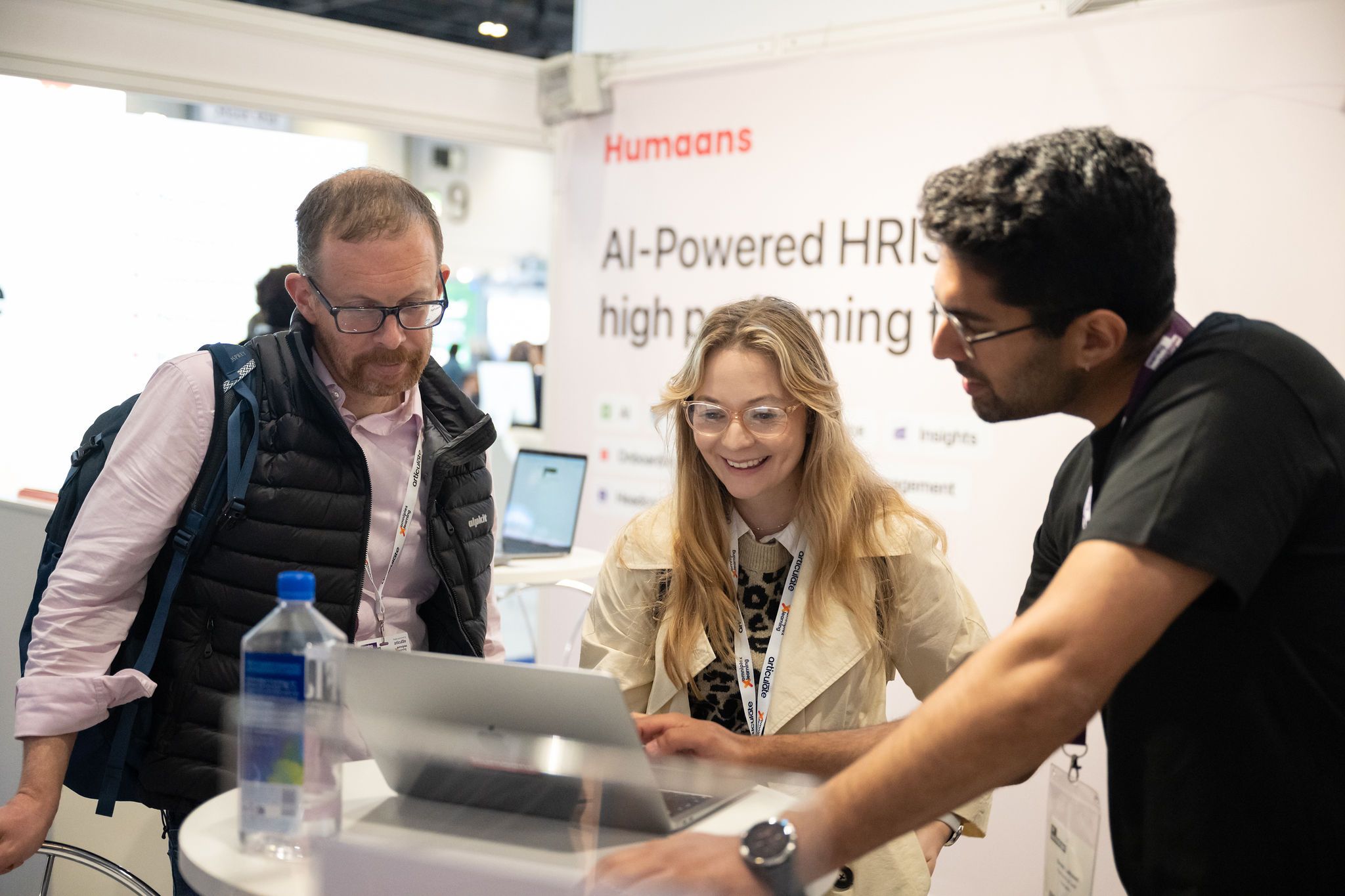 Visitors interacting with an exhibitor at HR Technologies UK