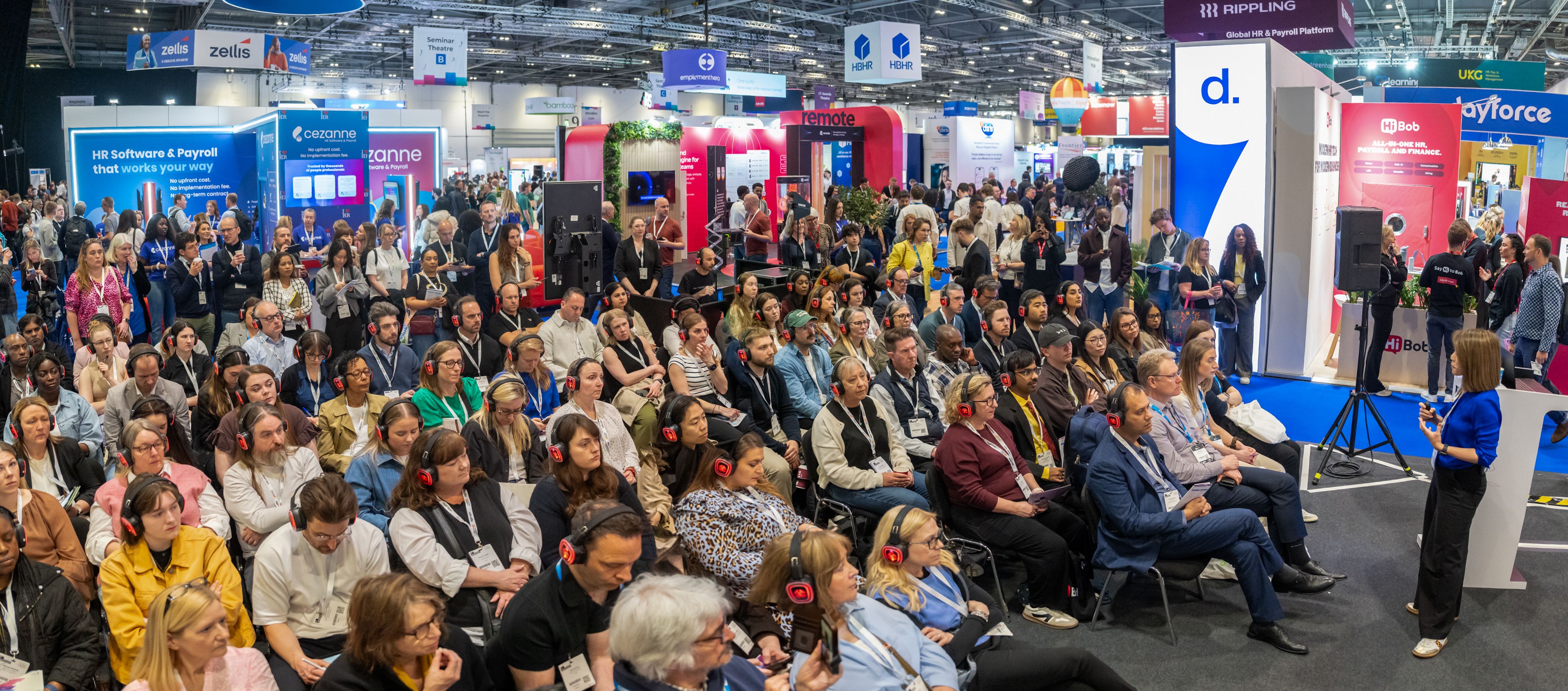 A crowd of people watching a seminar session at HR Technologies UK