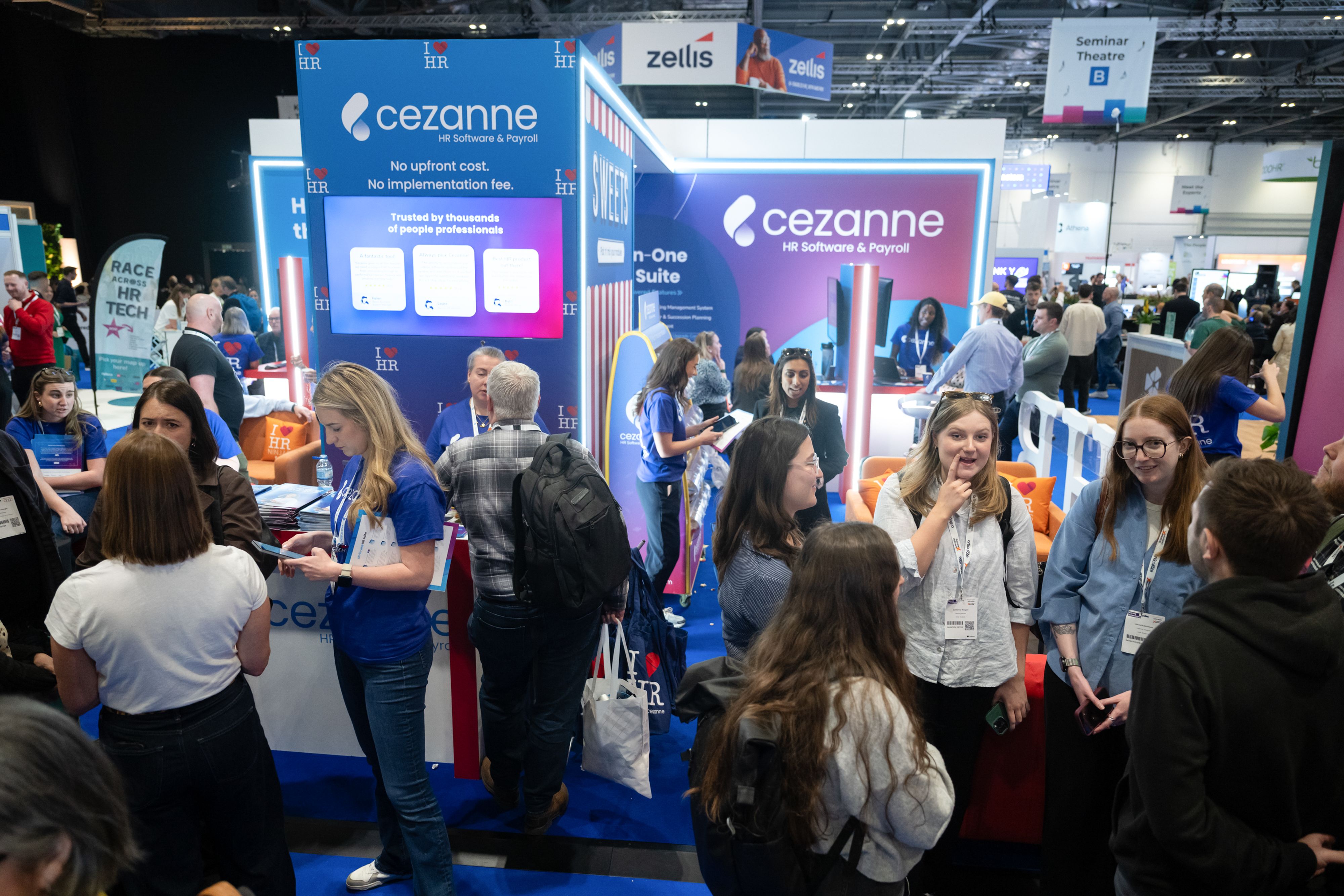 Group of people stood on an exhibitors stand at HR Technologies UK