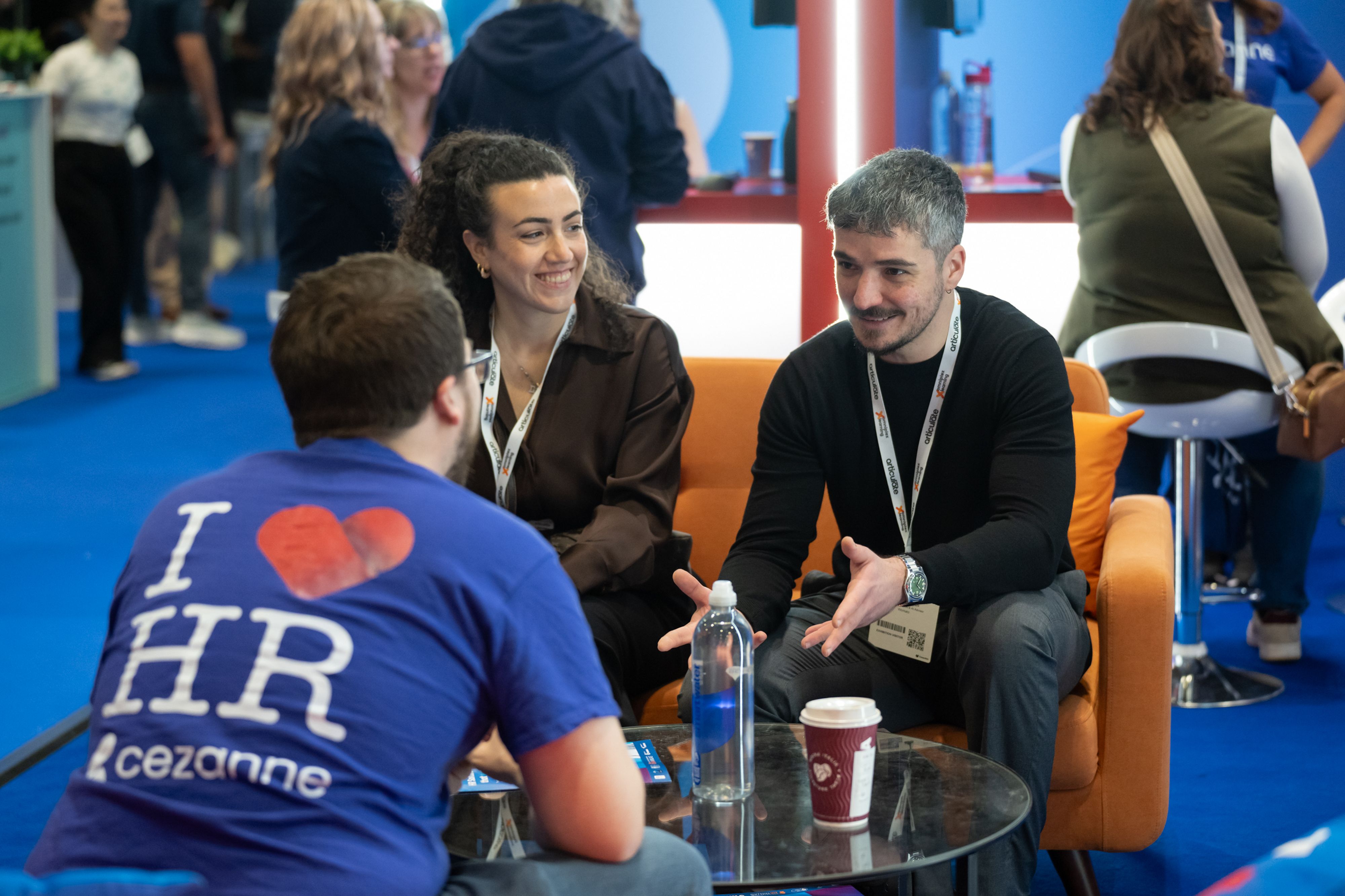 A visitor speaking to an exhibitor at HR Technologies UK