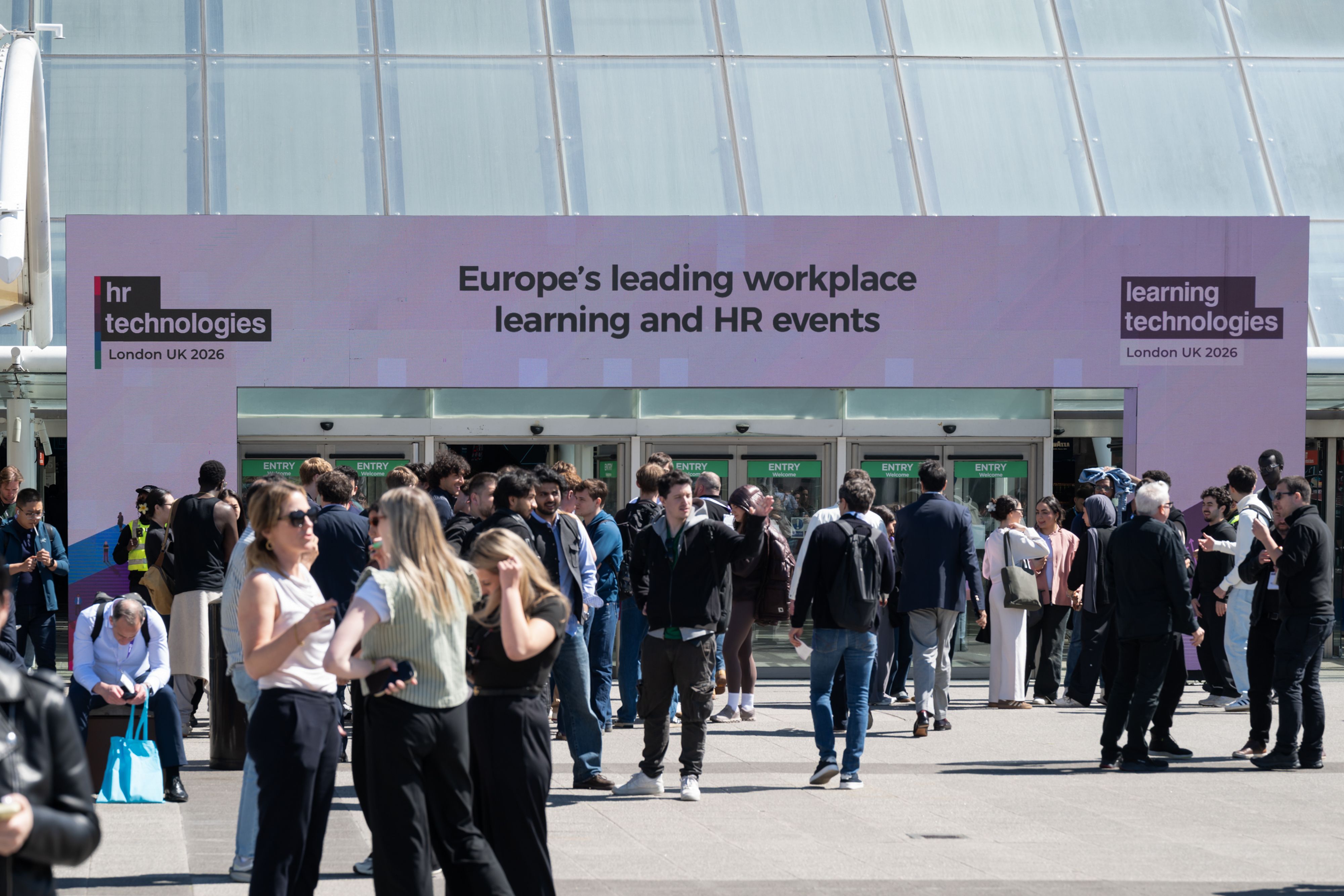 A shot from outside the Excel, showing the light-up archway with branding for HR Technologies UK and Learning Technologies.