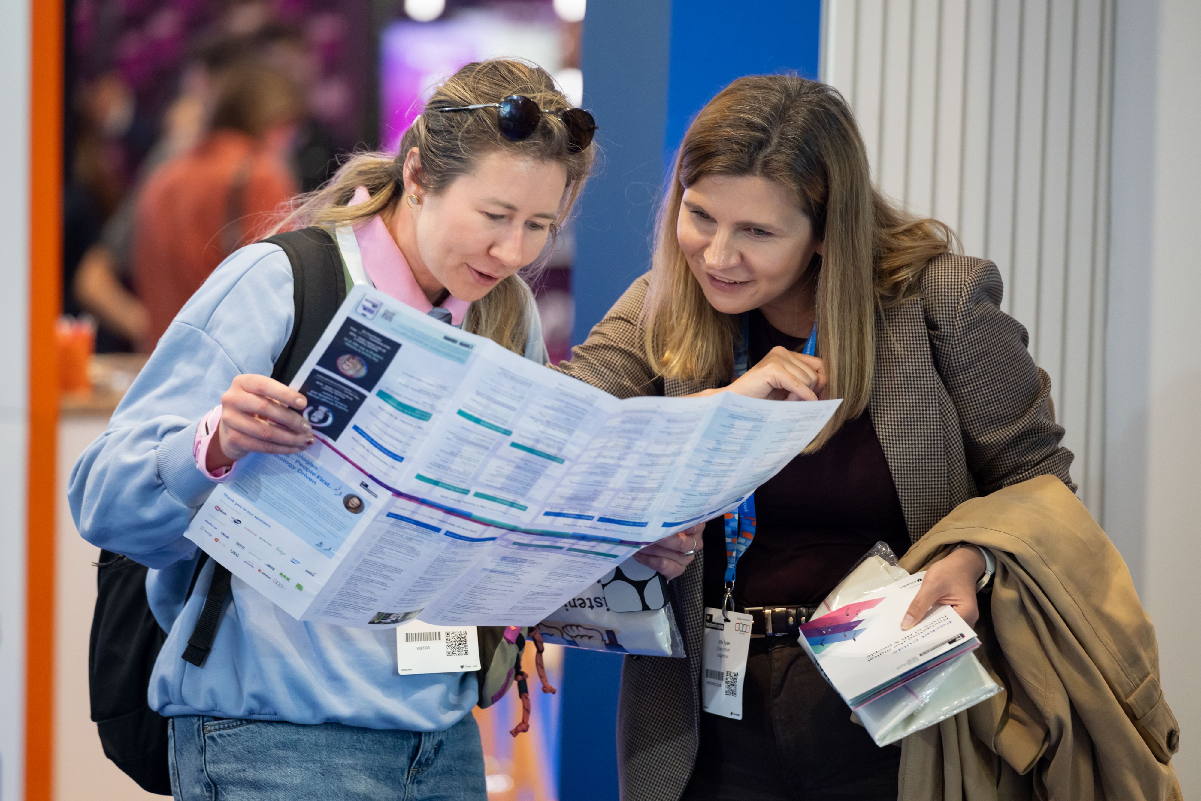 Visitors looking at the floorplan of HR Technologies UK