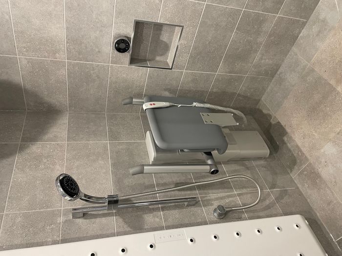 Powered shower seat