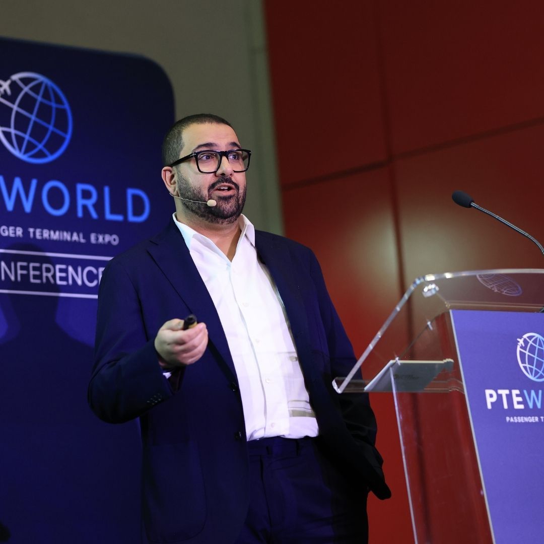 Photo shows a speaker at PTE World Conference