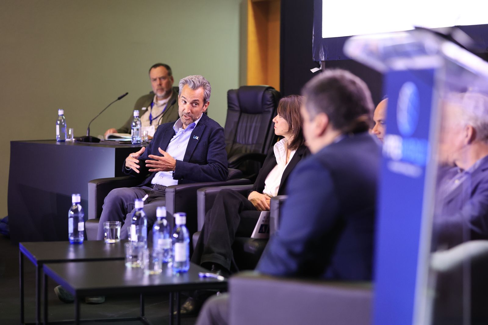 Panel discussion on a conference stage