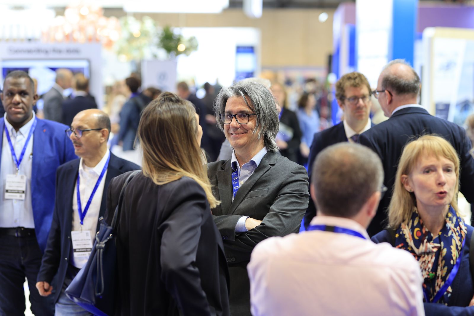 Visitors networking on the exhibition floor