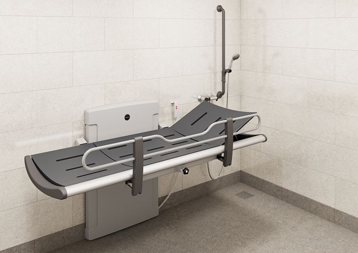 SCT 3000 shower change table, electrically height adjustable