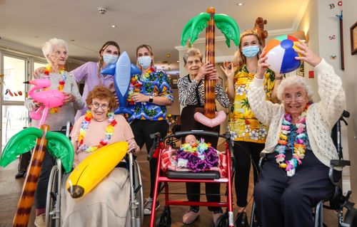 Care home residents enjoy Hawaiian party with tropical mocktails and coconut bowling
