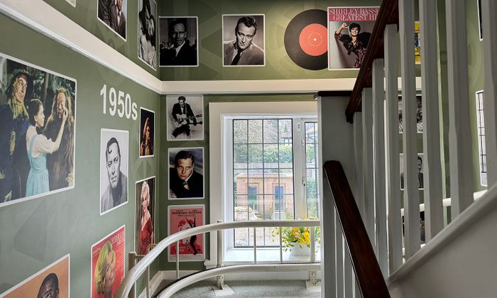 Bespoke films and music timeline mural design in care home hallway