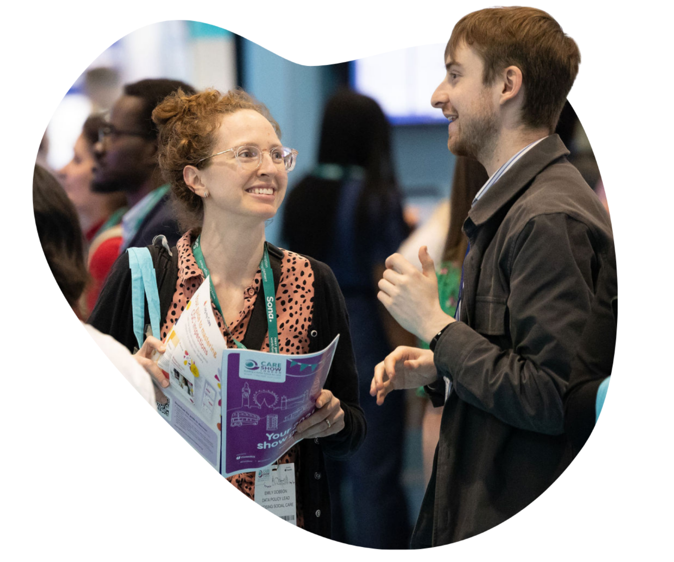 Men smiling in crowd