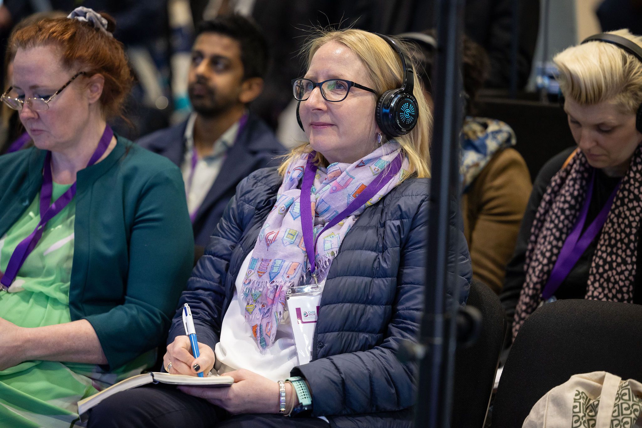 Woman smiling listening to a session