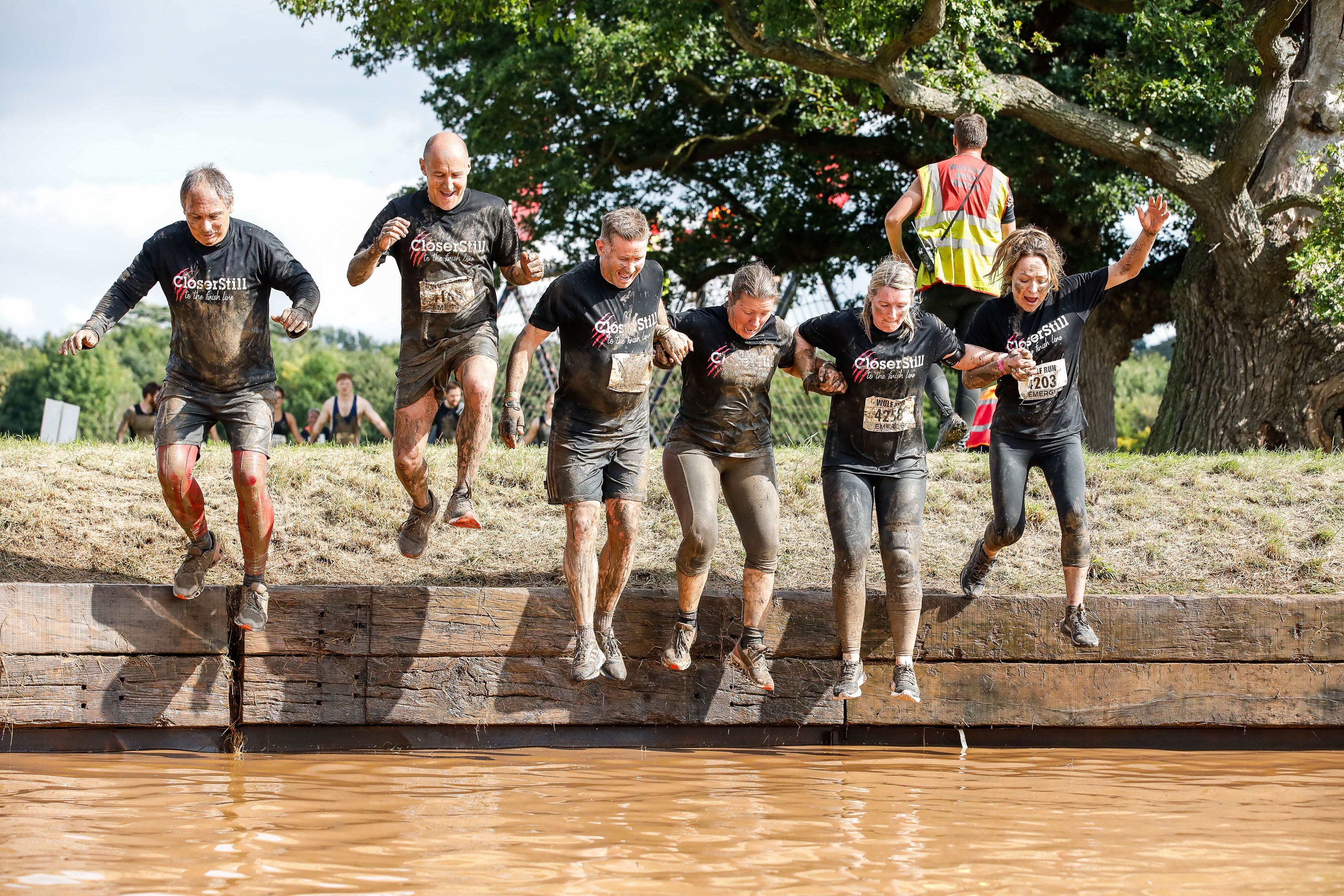 Sam and her team during a muddy run 