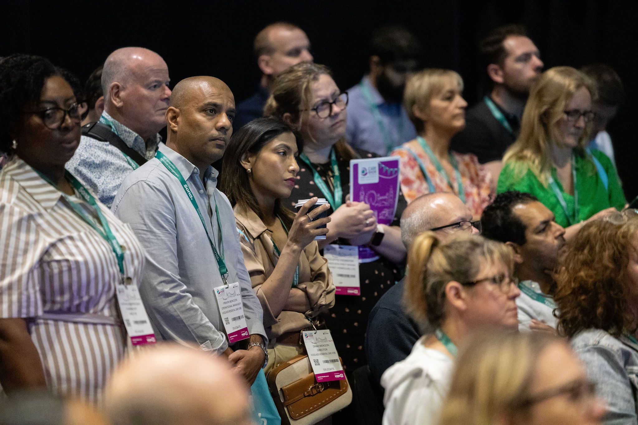 People listening to a seminar at the Care Show