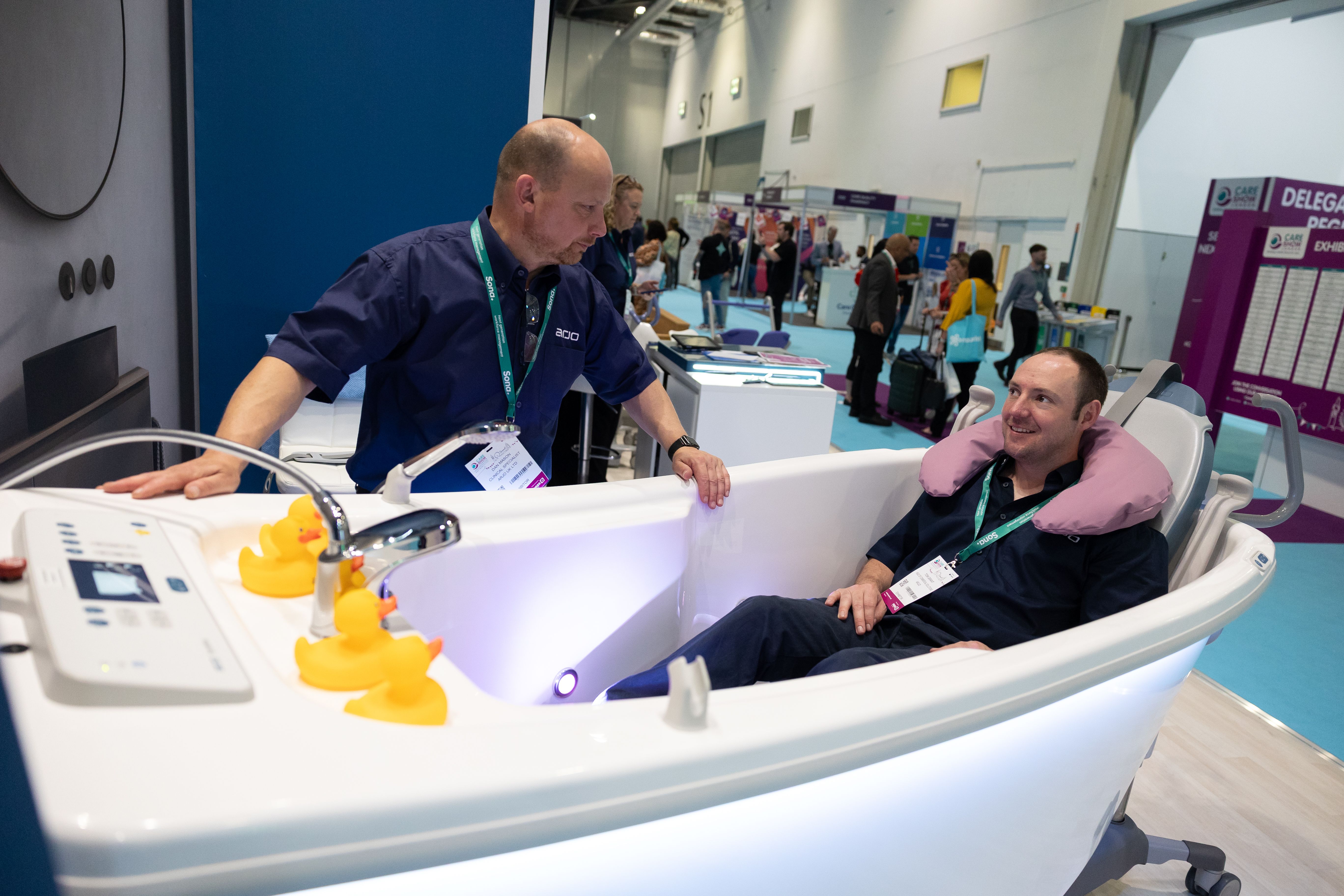 Man in a bath tub at Care Show London