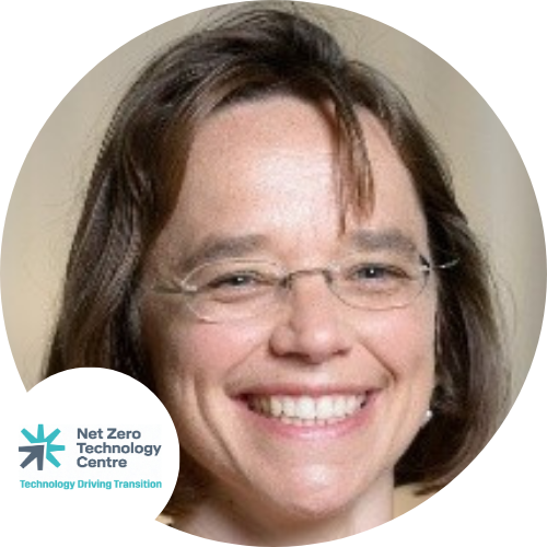 A lady with glasses smiling brightly with a company logo attached reading Net Zero Technology Centre