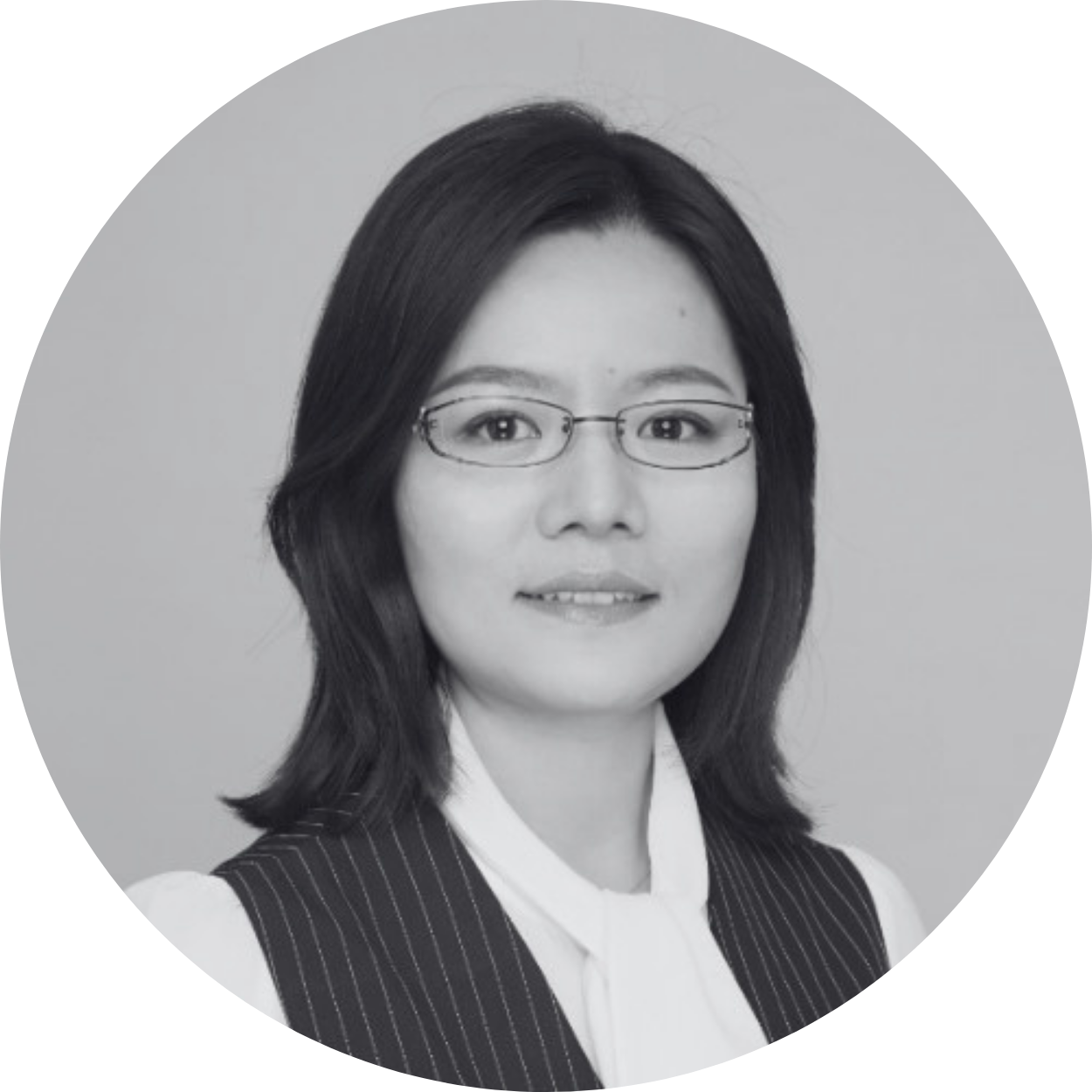 Smiling lady with dark hair and glasses